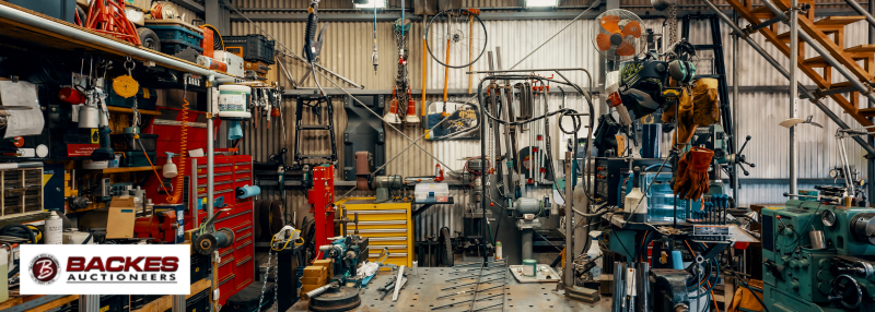 Image for Cluttered fabrication shop with equipment and tools scattered around