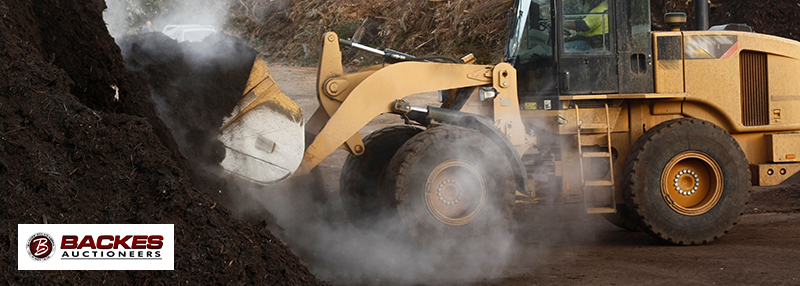 Image for Used excavator digging up dirt