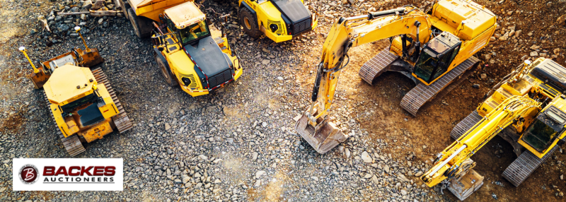 Image for Aerial view of construction machinery on jobsite including excavator and dump truck