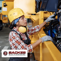 Image for Female worker inspecting machinery 